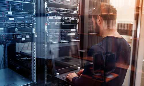 IT technician working in server room